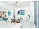Modern living room featuring sleek furnishings and a beautiful ocean view on TV at 7500 Palm Island S Dr # 2111, Placida, FL 33946