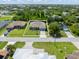 Aerial view shows the home and neighborhood layout, highlighting the property's location at 9151 Melody Cir, Port Charlotte, FL 33981
