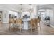 Modern kitchen with white cabinets, a center island, and stylish barstool seating at 9151 Melody Cir, Port Charlotte, FL 33981