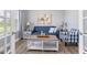 Cozy living room featuring a blue sofa, decorative pillows, and a patterned armchair at 9151 Melody Cir, Port Charlotte, FL 33981