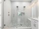 This bathroom features a glass shower stall with dual shower heads and mosaic flooring at 9151 Melody Cir, Port Charlotte, FL 33981