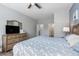 The main bedroom includes an entertainment center and light-colored wood-look floors at 9151 Melody Cir, Port Charlotte, FL 33981