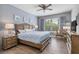 Serene bedroom with wood floors, soft lighting, and blue accents, creating a relaxing retreat at 9151 Melody Cir, Port Charlotte, FL 33981