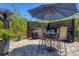 Cozy patio area with an umbrella-covered table, perfect for outdoor dining and entertaining at 9213 Spring Cir, Port Charlotte, FL 33981
