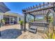 Beautiful backyard area with pavers, hot tub under pergola, screened-in porch, and potted plants at 9213 Spring Cir, Port Charlotte, FL 33981