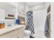 Bathroom with tub and shower combination and ample storage at 9213 Spring Cir, Port Charlotte, FL 33981