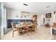 Elegant dining room with stylish wainscoting, neutral decor, and a wooden dining table set for a meal at 9213 Spring Cir, Port Charlotte, FL 33981