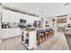 An oversized kitchen island with granite countertops and seating overlooks the living area at 9213 Spring Cir, Port Charlotte, FL 33981