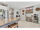 The open kitchen offers an island with granite countertops, seating, and decor at 9213 Spring Cir, Port Charlotte, FL 33981