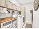Spacious laundry room with modern appliances and storage at 9213 Spring Cir, Port Charlotte, FL 33981
