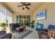 Relaxing covered patio with comfortable seating and entertainment area at 9213 Spring Cir, Port Charlotte, FL 33981
