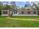 Single-wide manufactured home with gray and beige siding at 6144 La Pine Rd, Brooksville, FL 34602