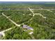 House on a wooded lot, seen from a distance at 14271 Regency Ct, Weeki Wachee, FL 34614