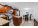 Kitchen with granite countertops and dark wood cabinets at 12511 Walton Ave, New Port Richey, FL 34654