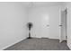 Simple bedroom with grey carpet, a ceiling fan, and white walls at 12511 Walton Ave, New Port Richey, FL 34654