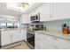 Modern kitchen with stainless steel appliances and granite countertops at 103 1St E St # 204, St Petersburg, FL 33715