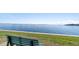 Serene waterfront view with a park bench at 103 1St E St # 204, St Petersburg, FL 33715