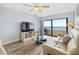 Living area showcasing a large TV, water views, and light flooring at 103 1St E St # 204, St Petersburg, FL 33715