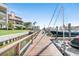 Wooden community dock with boats and water access at 103 1St E St # 204, St Petersburg, FL 33715