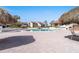Community pool area with patio furniture and thatch umbrellas at 103 1St E St # 204, St Petersburg, FL 33715