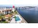 Aerial view of waterfront property with pool and bridge at 103 1St E St # 204, St Petersburg, FL 33715