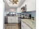 Bright kitchen with stainless steel appliances and granite countertops at 103 1St E St # 204, St Petersburg, FL 33715