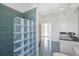 Bathroom with glass block shower and tiled walls at 17847 Dansville Dr, Spring Hill, FL 34610