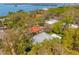 Stunning aerial view of a home nestled among lush trees, near tranquil waters, offering privacy and scenic beauty at 8285 28Th N Ave, St Petersburg, FL 33710