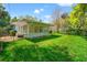 Well-maintained backyard features lush lawn and mature trees providing shade at 8285 28Th N Ave, St Petersburg, FL 33710