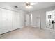 Spacious bedroom featuring mirrored closet doors and connected bathroom space at 8285 28Th N Ave, St Petersburg, FL 33710