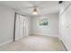 Neutral bedroom with natural light from windows and smooth terrazzo flooring at 8285 28Th N Ave, St Petersburg, FL 33710