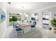 Staged dining area featuring bright dining table, access to backyard, and connected kitchen space at 8285 28Th N Ave, St Petersburg, FL 33710