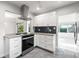 Bright and modern kitchen with stainless steel range hood and granite countertops at 8285 28Th N Ave, St Petersburg, FL 33710