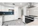Well-equipped kitchen with white cabinetry, stainless steel appliances, and granite countertops at 8285 28Th N Ave, St Petersburg, FL 33710