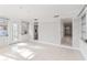 Bright living room has tile flooring and a doorway offering an open view into the adjacent room at 8285 28Th N Ave, St Petersburg, FL 33710