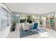 Well-lit home office features a comfortable desk with a rolling chair and built-in bookcase at 8285 28Th N Ave, St Petersburg, FL 33710