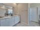 Bathroom features double sinks, granite countertops, and modern fixtures at 14069 Wineberry Dr, Dade City, FL 33525
