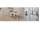 Bright dining area with a table, chairs, and view of the home's entry at 14069 Wineberry Dr, Dade City, FL 33525