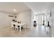Bright dining room leading to the front entryway and a view of the front door at 14069 Wineberry Dr, Dade City, FL 33525