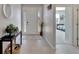 Inviting foyer with a white front door, a neutral color scheme, and modern tiled flooring at 14069 Wineberry Dr, Dade City, FL 33525
