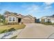 Lovely single story home featuring a well maintained lawn and attached two car garage at 14069 Wineberry Dr, Dade City, FL 33525