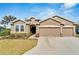 Beautiful single story home with a two car garage and lovely landscaping at 14069 Wineberry Dr, Dade City, FL 33525