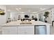 Open concept living space with a kitchen island that includes a sink at 14069 Wineberry Dr, Dade City, FL 33525