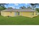 Lush backyard with a spacious patio, perfect for relaxing and entertaining guests at 3143 Grayton Dr, Spring Hill, FL 34609