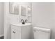 Updated bathroom features a new white vanity and a modern faucet at 3143 Grayton Dr, Spring Hill, FL 34609