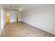 Bright bedroom with wood floors, neutral paint, and closet access at 3143 Grayton Dr, Spring Hill, FL 34609