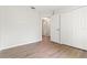 Bright bedroom with light gray vinyl floors and a double door closet at 3143 Grayton Dr, Spring Hill, FL 34609