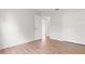 Bedroom with updated gray vinyl floors and an entrance to the hallway at 3143 Grayton Dr, Spring Hill, FL 34609
