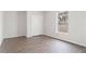 Bedroom showcasing neutral walls, a large window, and a double-door closet at 3143 Grayton Dr, Spring Hill, FL 34609