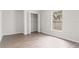 Bright bedroom with a window and closet showcasing modern vinyl flooring at 3143 Grayton Dr, Spring Hill, FL 34609